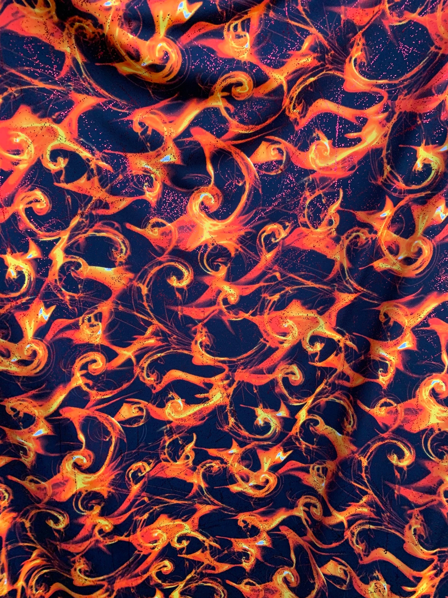 New tornado fire design with foggy foil heavy nylon spandex 4way stretch 58/60" Sold by the YD. Ships worldwide from Los Angeles California.