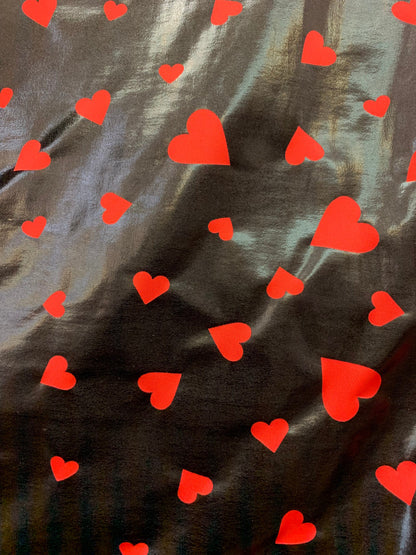 New metallic nylon spandex heart design Black/red all over foil 4-way stretch 58/60” Sold by the YD. Ships worldwide from Los Angeles CA USA