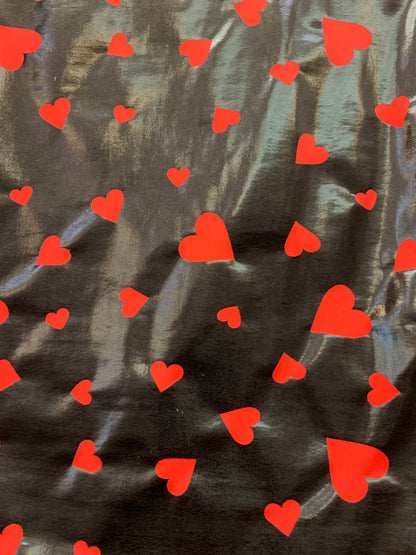 New metallic nylon spandex heart design Black/red all over foil 4-way stretch 58/60” Sold by the YD. Ships worldwide from Los Angeles CA USA