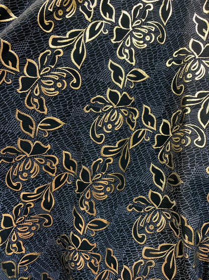 New metallic poly spandex flower design Black/gold 2-way stretch 58/60” Sold by the YD. Ships worldwide from Los Angeles California USA.