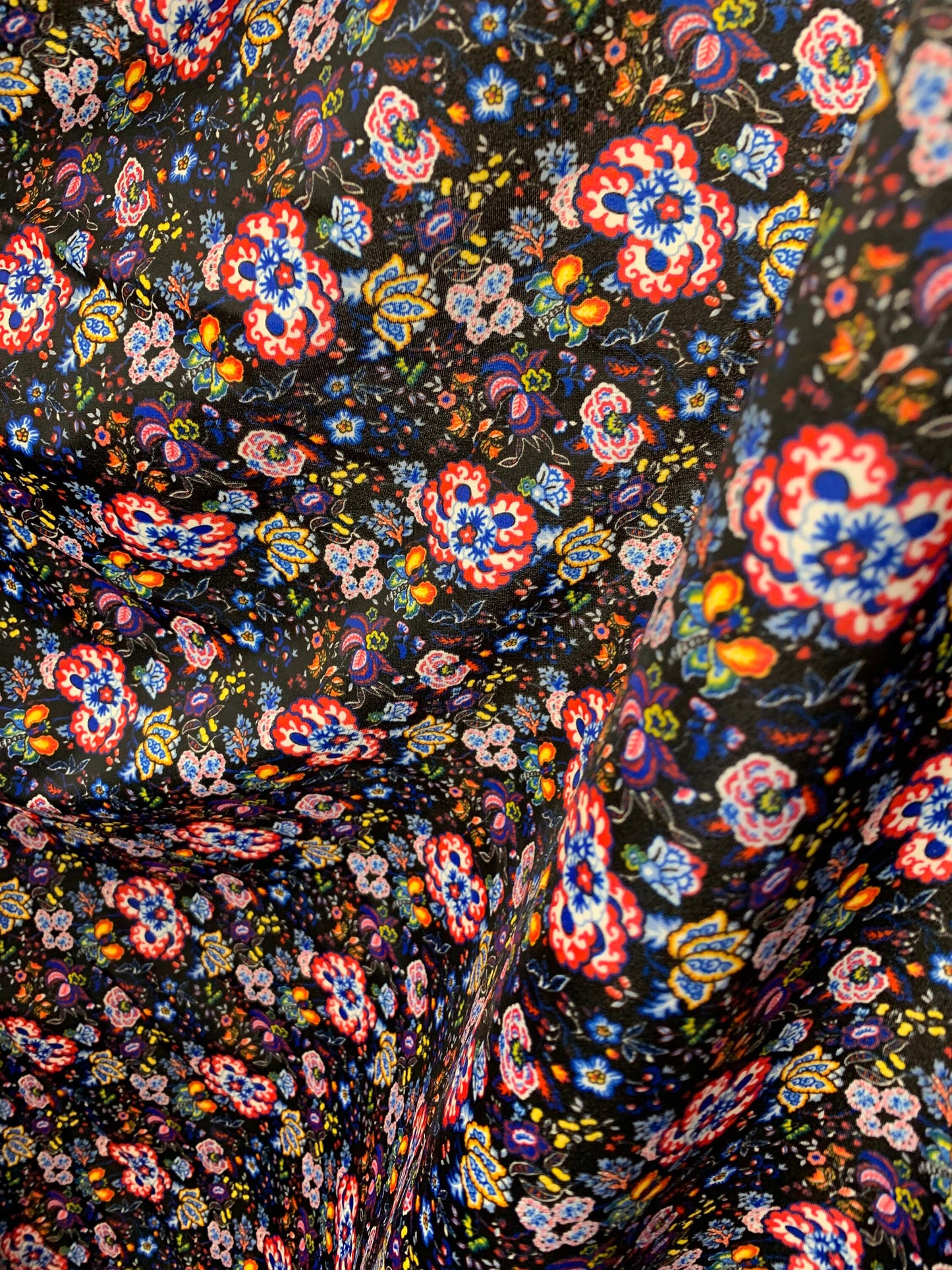 New multi flower design black/multicolor print nylon spandex 4-way stretch 58/60” Sold by the YD. Ships worldwide from Los Angeles CA USA.