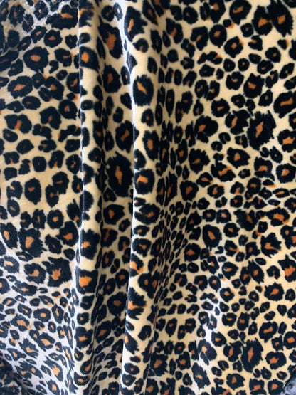 New premier exotic Leopard design print on stretch velvet 4-way 58/60" Sold By The YD. Ships worldwide from Los Angeles California USA.