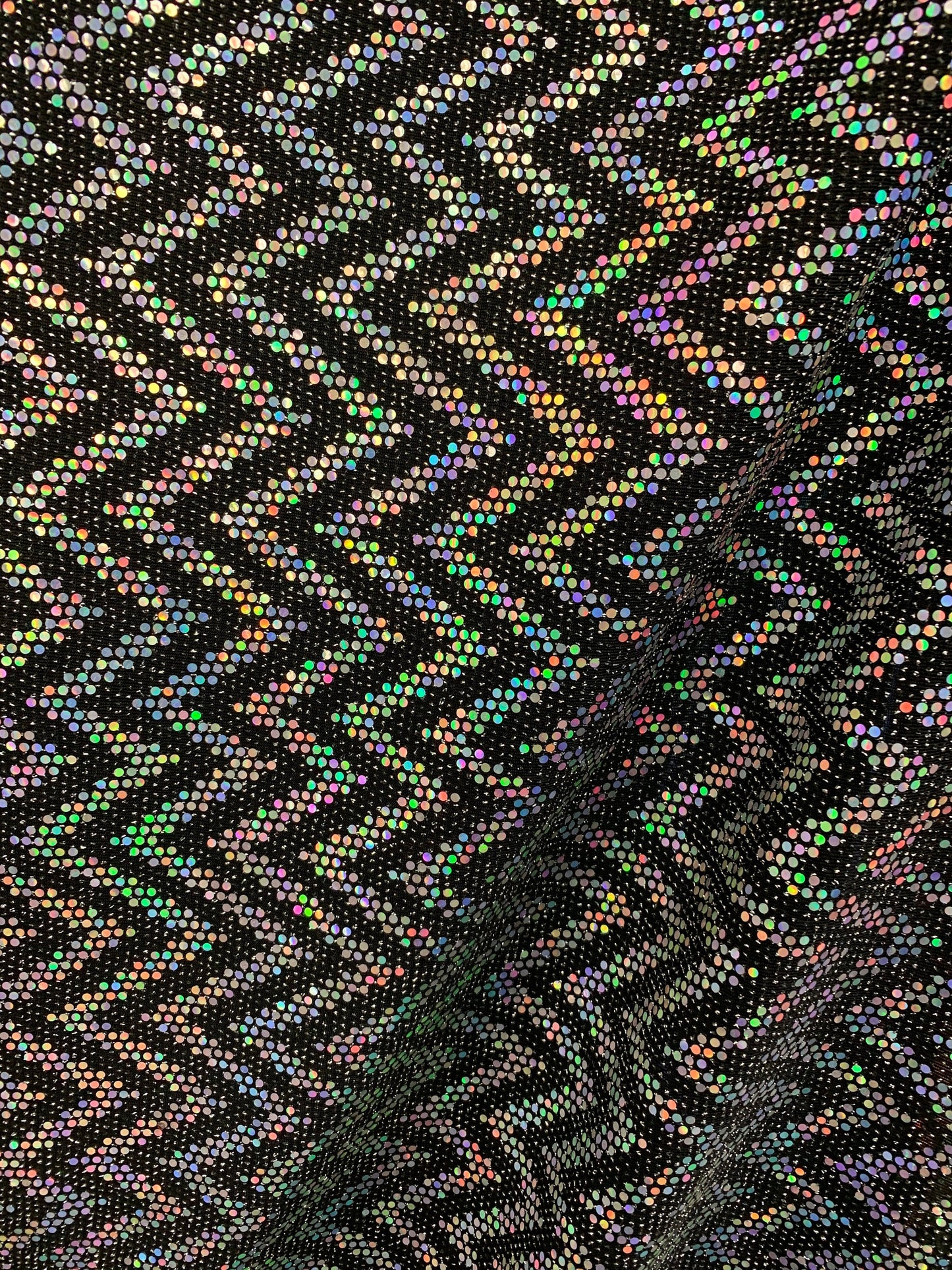 New zig zag hologram sequins design on stretch metallic spandex 2-way 58/60” Sold by the YD. Ships worldwide from Los Angeles California USA