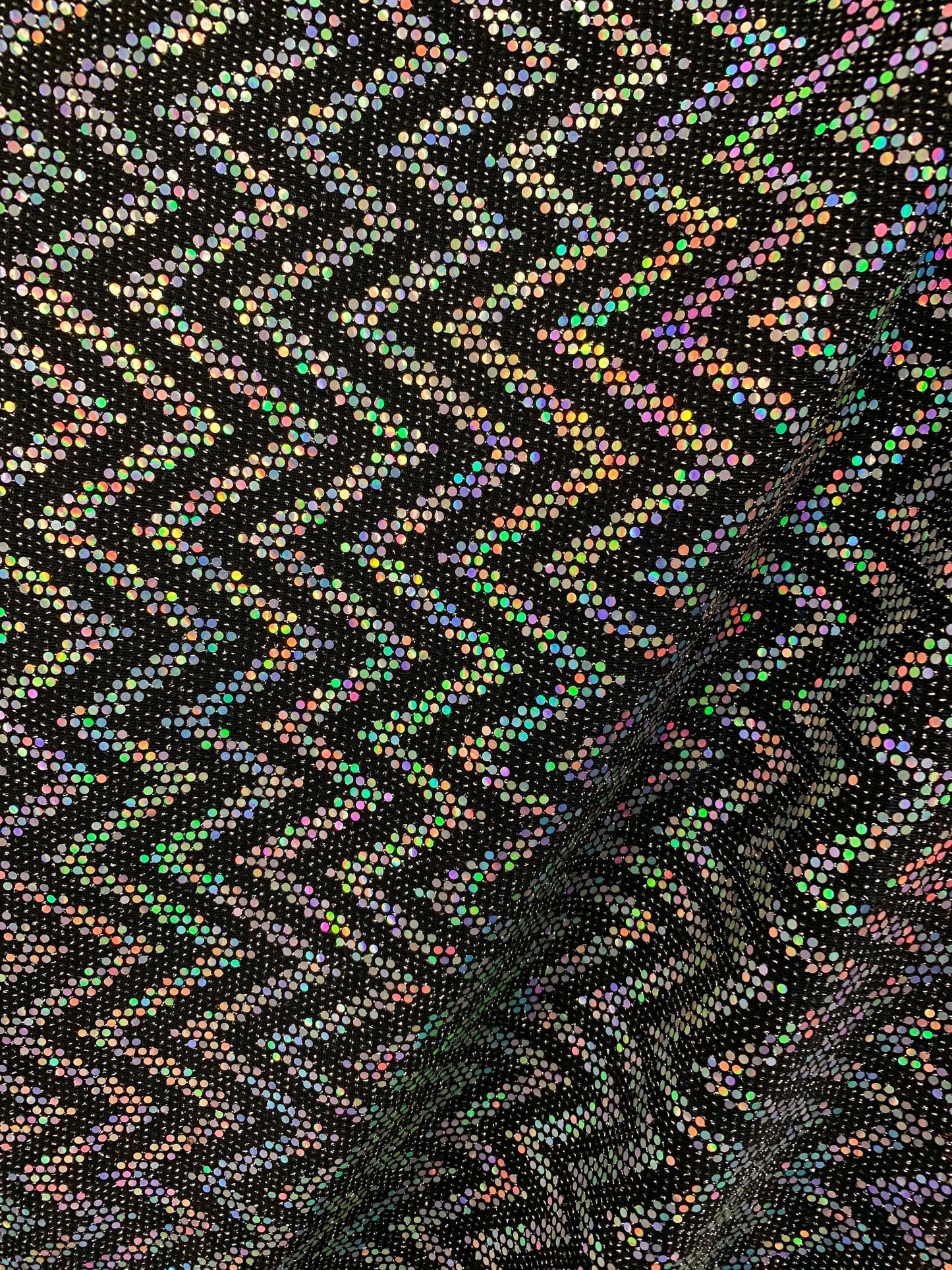 New zig zag hologram sequins design on stretch metallic spandex 2-way 58/60” Sold by the YD. Ships worldwide from Los Angeles California USA