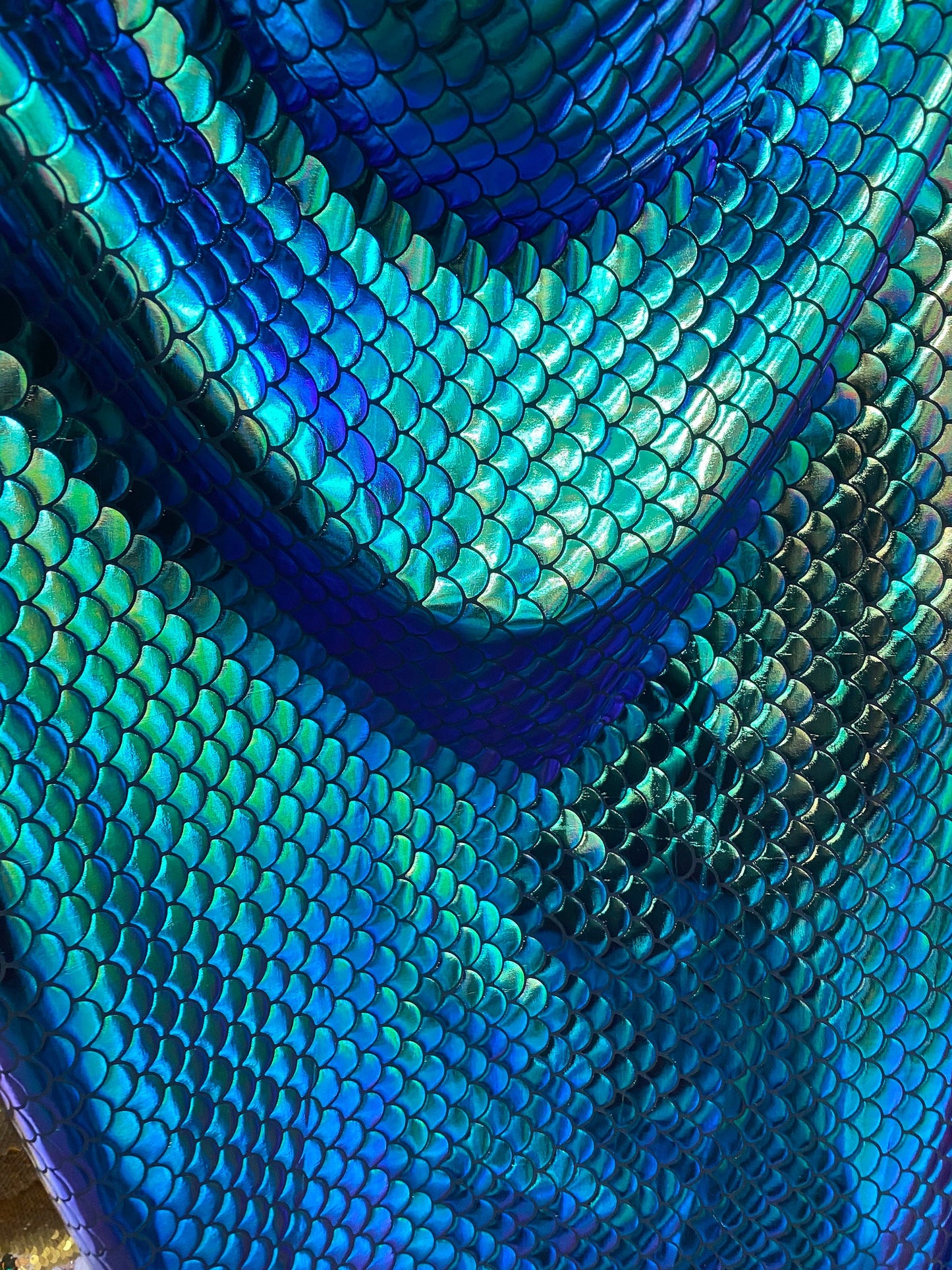 New mermaid design iridescent green metallic nylon spandex 4-way 58/60” Sold by the YD. Ships worldwide from Los Angeles California USA.