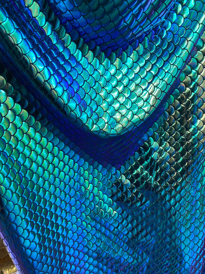 New mermaid design iridescent green metallic nylon spandex 4-way 58/60” Sold by the YD. Ships worldwide from Los Angeles California USA.