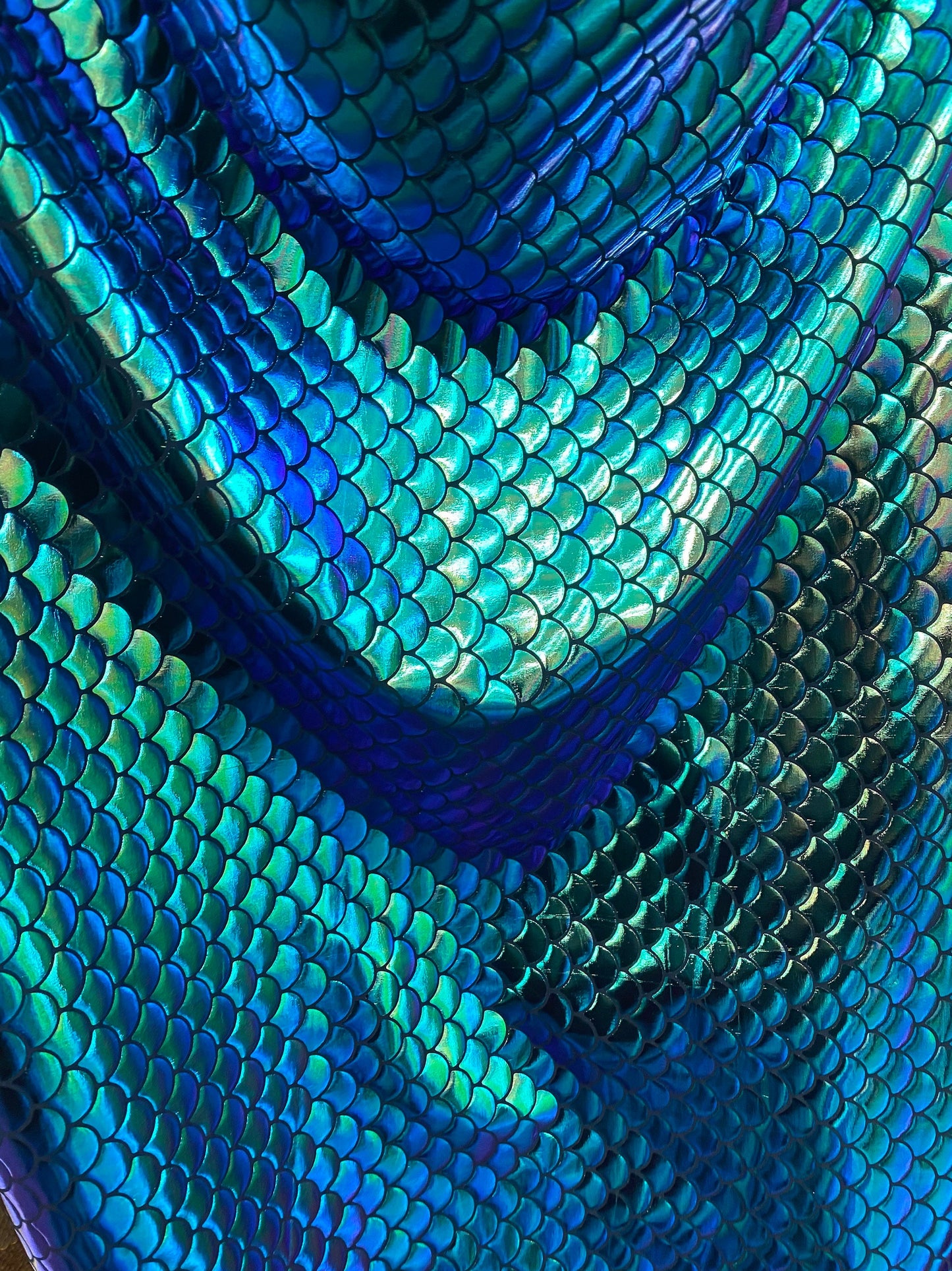 New mermaid design iridescent green metallic nylon spandex 4-way 58/60” Sold by the YD. Ships worldwide from Los Angeles California USA.