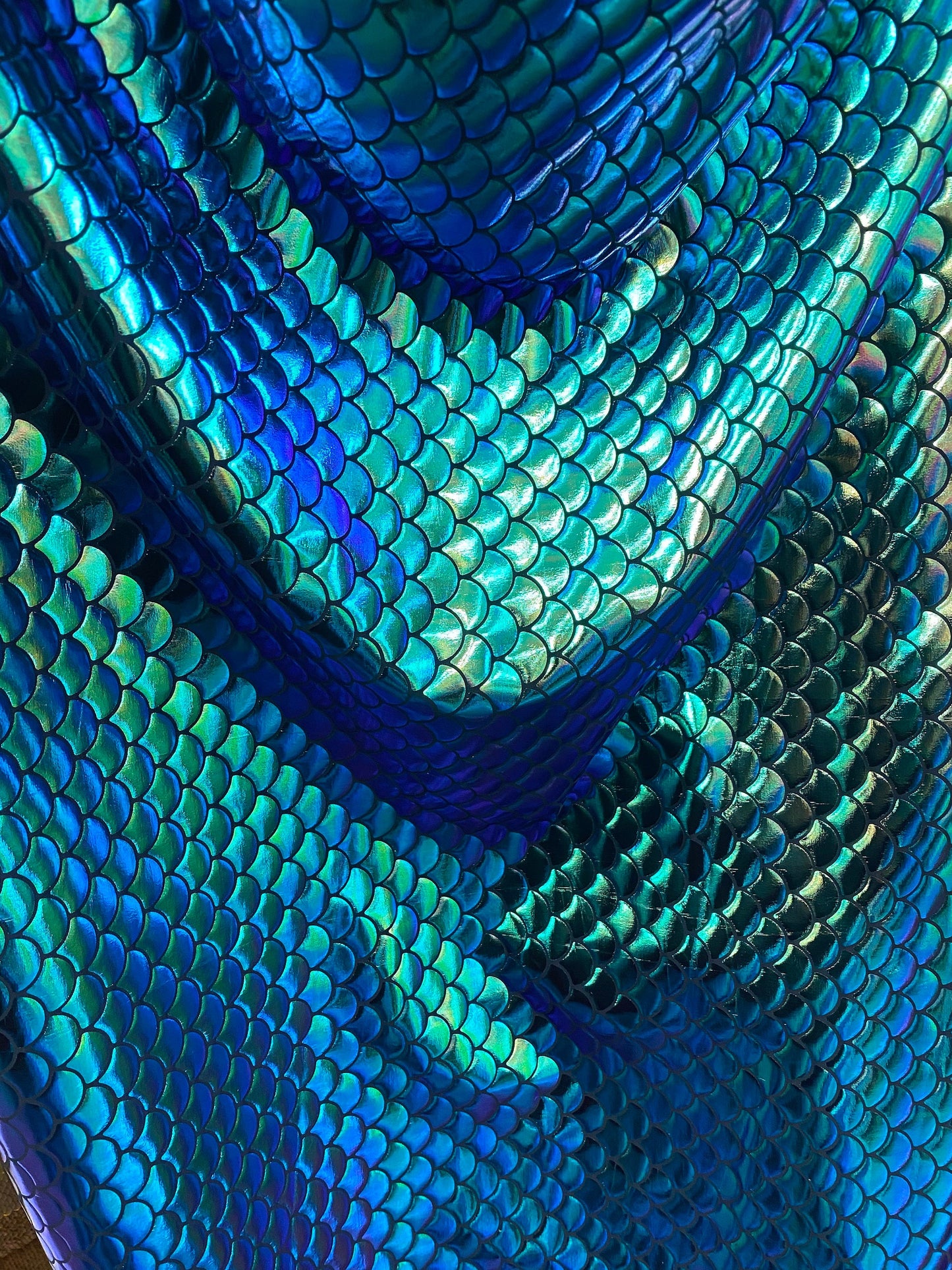 New mermaid design iridescent green metallic nylon spandex 4-way 58/60” Sold by the YD. Ships worldwide from Los Angeles California USA.