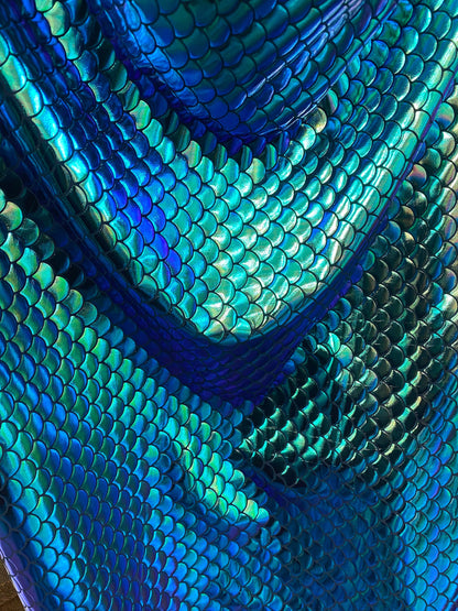 New mermaid design iridescent green metallic nylon spandex 4-way 58/60” Sold by the YD. Ships worldwide from Los Angeles California USA.