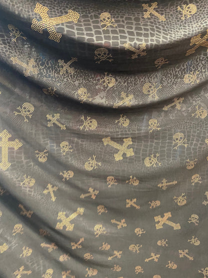 New poly spandex skulls and cross design 2-way stretch 58/60”Sold by the YD. Ships worldwide from Los Angeles California USA.