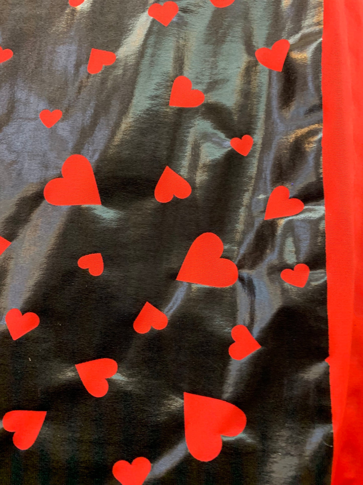 New metallic nylon spandex heart design Black/red all over foil 4-way stretch 58/60” Sold by the YD. Ships worldwide from Los Angeles CA USA