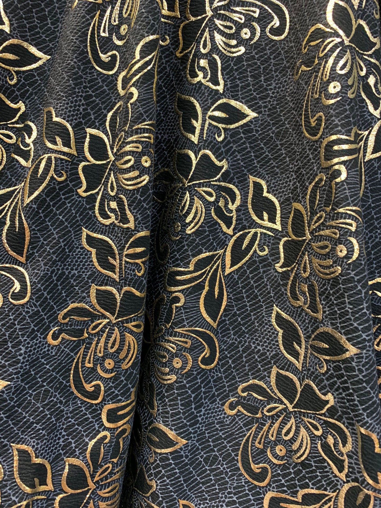 New metallic poly spandex flower design Black/gold 2-way stretch 58/60” Sold by the YD. Ships worldwide from Los Angeles California USA.