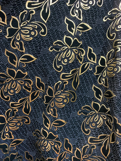 New metallic poly spandex flower design Black/gold 2-way stretch 58/60” Sold by the YD. Ships worldwide from Los Angeles California USA.