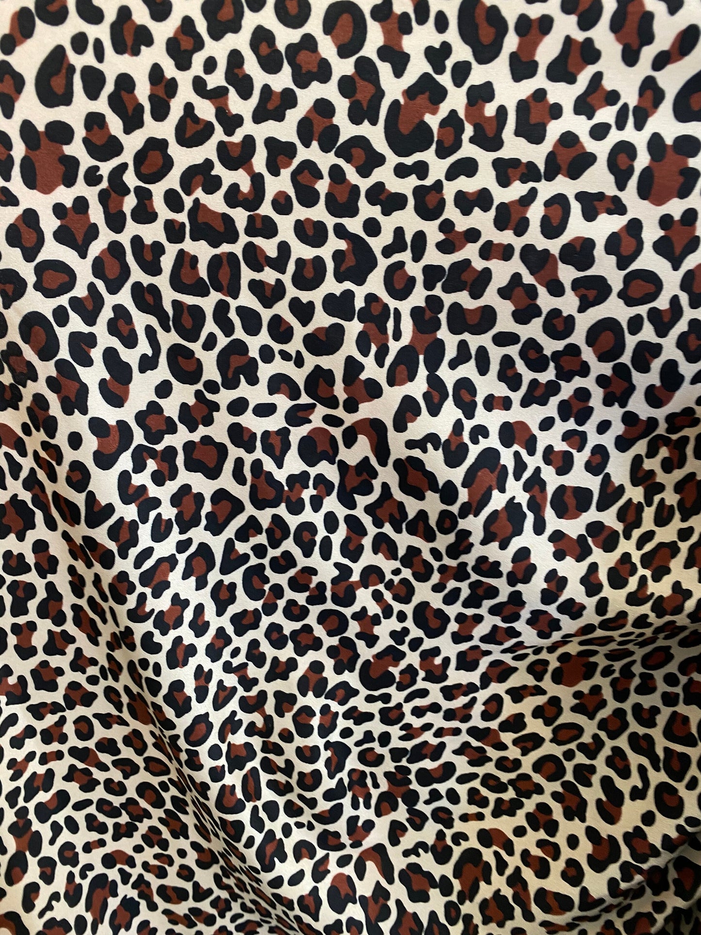 New leopard design animal print on  nylon spandex 4-way 58/60” Sold by the YD. Ships worldwide from Los Angeles California USA.