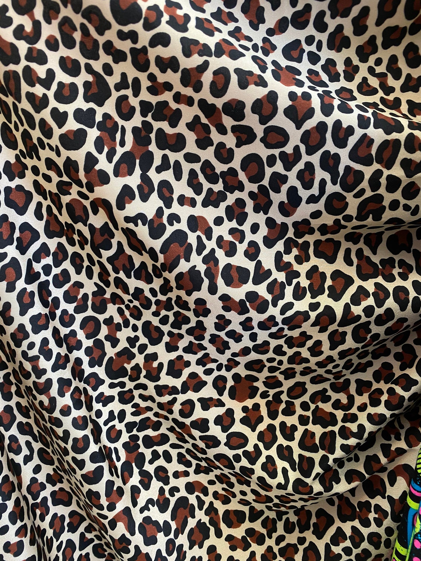 New leopard design animal print on  nylon spandex 4-way 58/60” Sold by the YD. Ships worldwide from Los Angeles California USA.