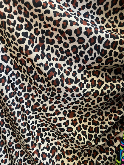 New leopard design animal print on  nylon spandex 4-way 58/60” Sold by the YD. Ships worldwide from Los Angeles California USA.