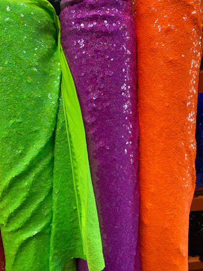 New overlapping sequins neon colors on spandex base 2-way stretch 58/60” Sold by the YD. Ships worldwide from Los Ángeles California USA.