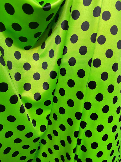 New polka dots design neon lime green with black dots nylon spandex 4-way stretch 58/60” Sold by the YD. Ships worldwide from Los Angeles CA