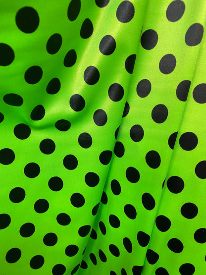 New polka dots design neon lime green with black dots nylon spandex 4-way stretch 58/60” Sold by the YD. Ships worldwide from Los Angeles CA