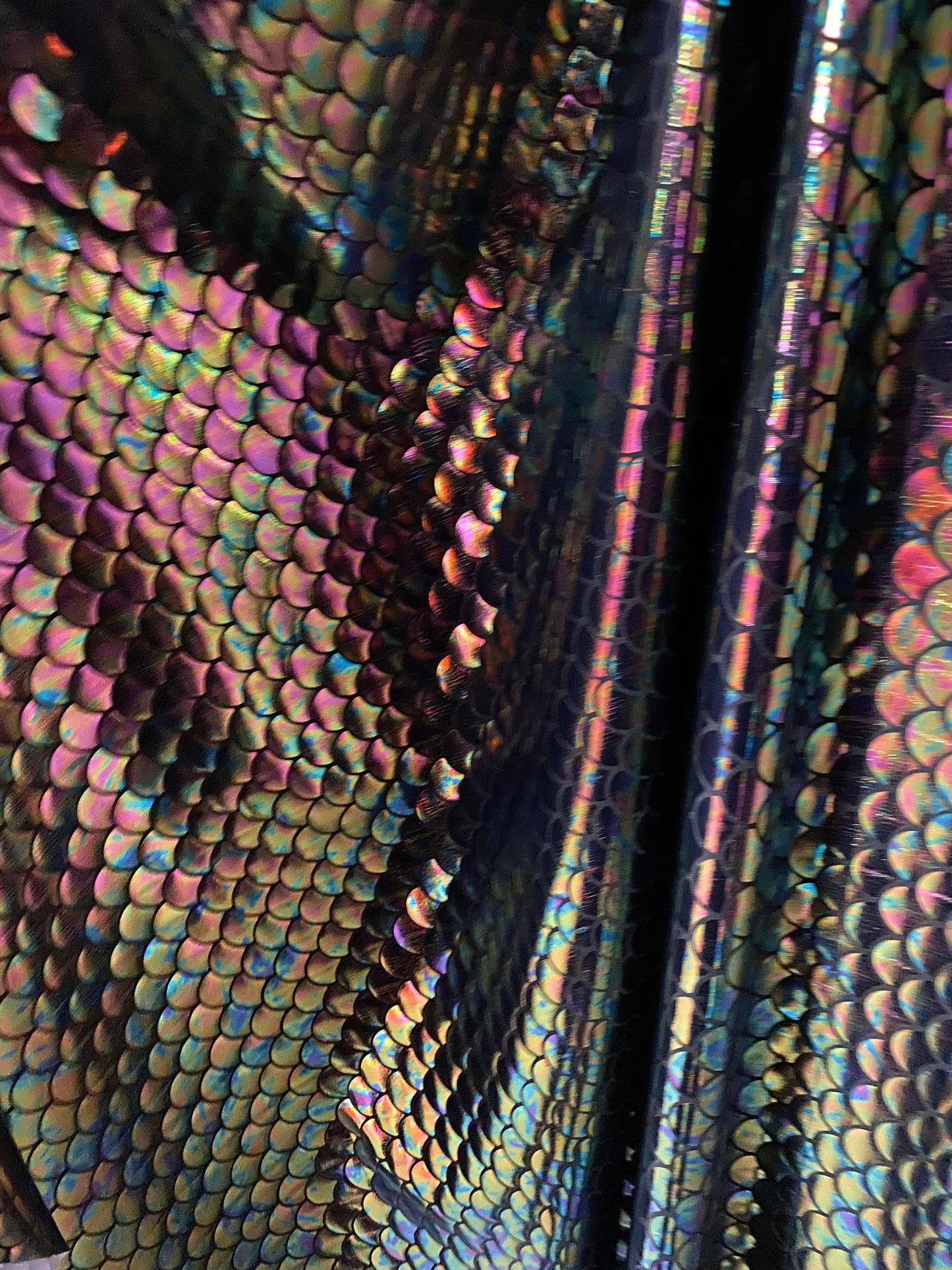 New iridescent black mermaid design on nylon spandex 4way Stretch 58/60” Sold bu the YD. ships worldwide from Los Angeles California USA.