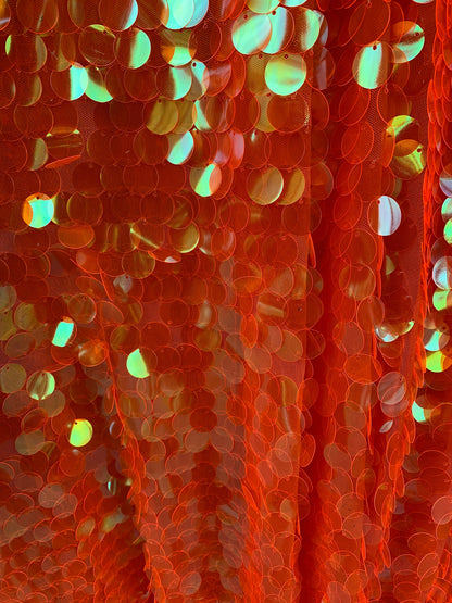 New Neon orange paillette sequins Iridescent orange 20mm size round sequins on stretch mesh 2-way 58/60” Sold by the YD. Ships worldwide.