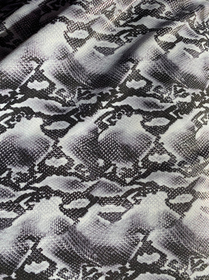 New exotic snake design metallic nylon spandex with clear dots 4-way stretch 58/60” Sold by the YD. Ships worldwide from Los Angeles CA USA.