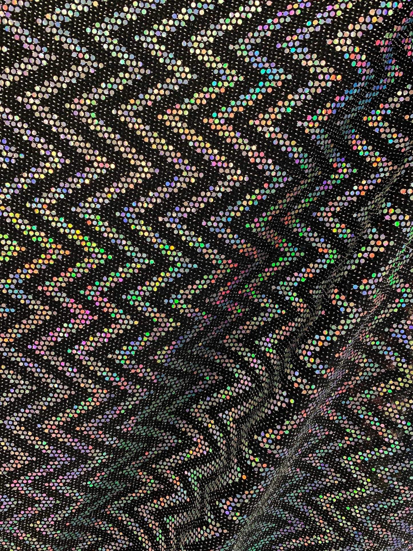 New zig zag hologram sequins design on stretch metallic spandex 2-way 58/60” Sold by the YD. Ships worldwide from Los Angeles California USA