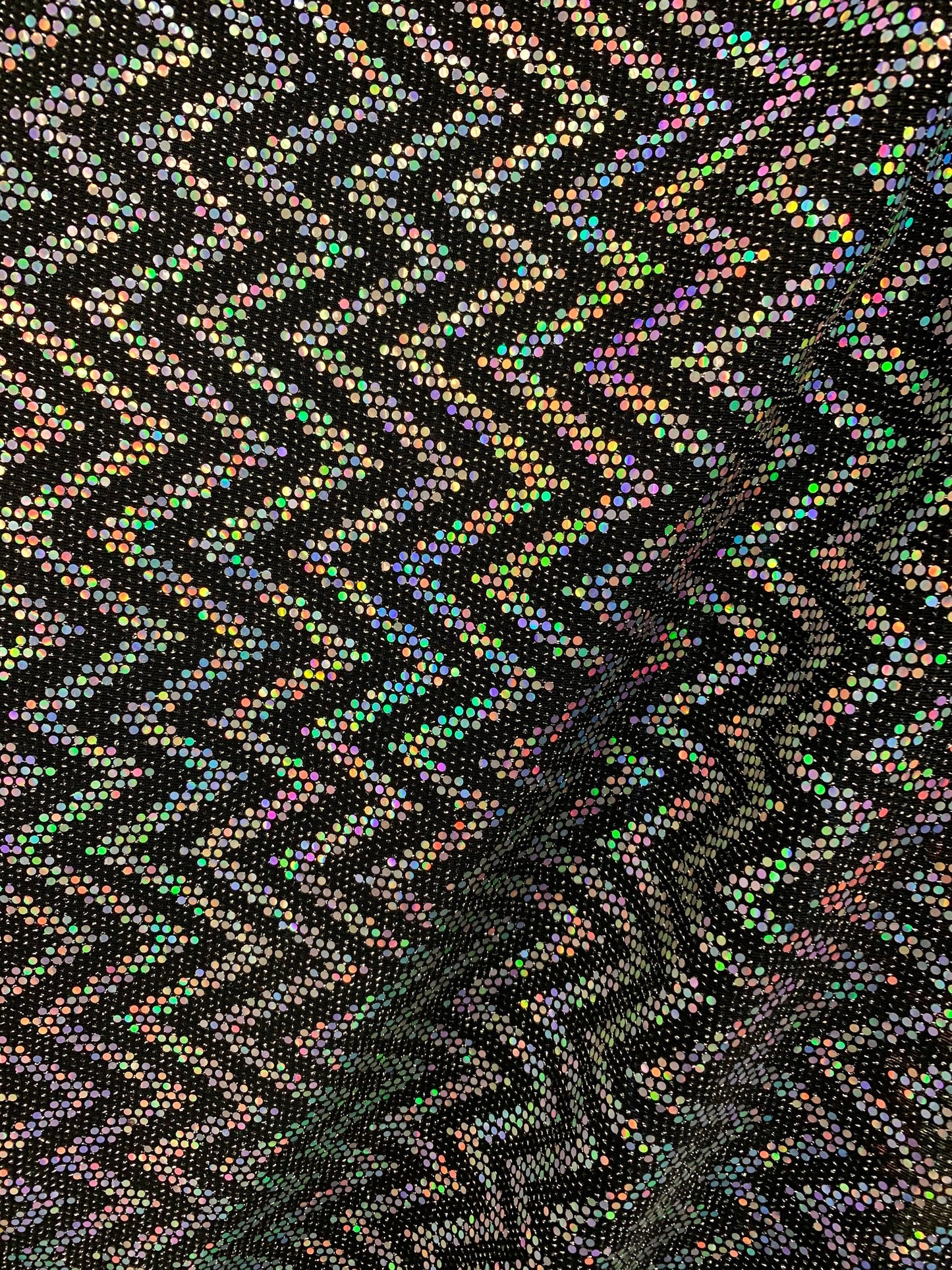 New zig zag hologram sequins design on stretch metallic spandex 2-way 58/60” Sold by the YD. Ships worldwide from Los Angeles California USA