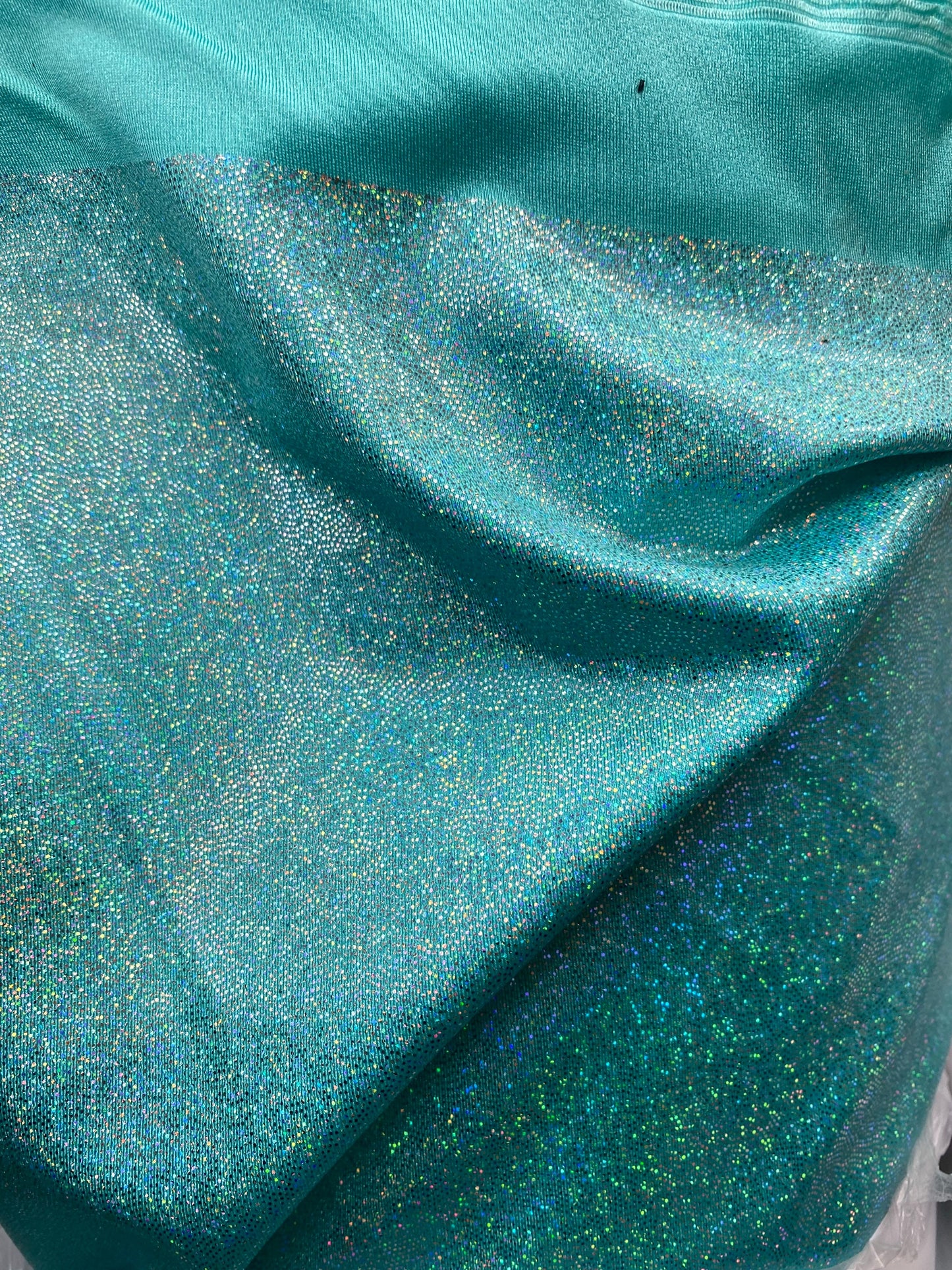 Sparkle hologram metallic nylon spandex 4way stretch 58/60” Sold by the YD. Ships worldwide from Los Angeles California USA.