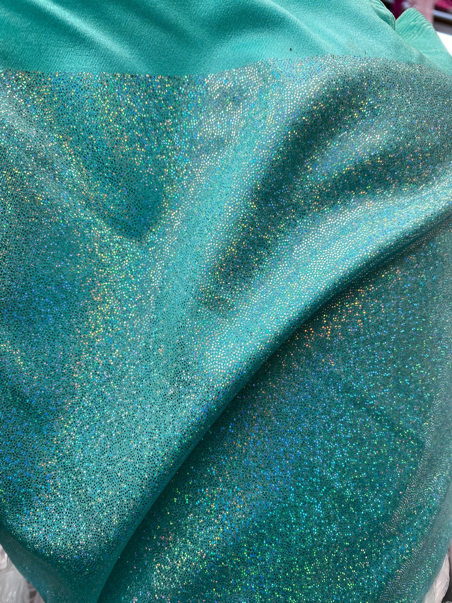 Sparkle hologram metallic nylon spandex 4way stretch 58/60” Sold by the YD. Ships worldwide from Los Angeles California USA.