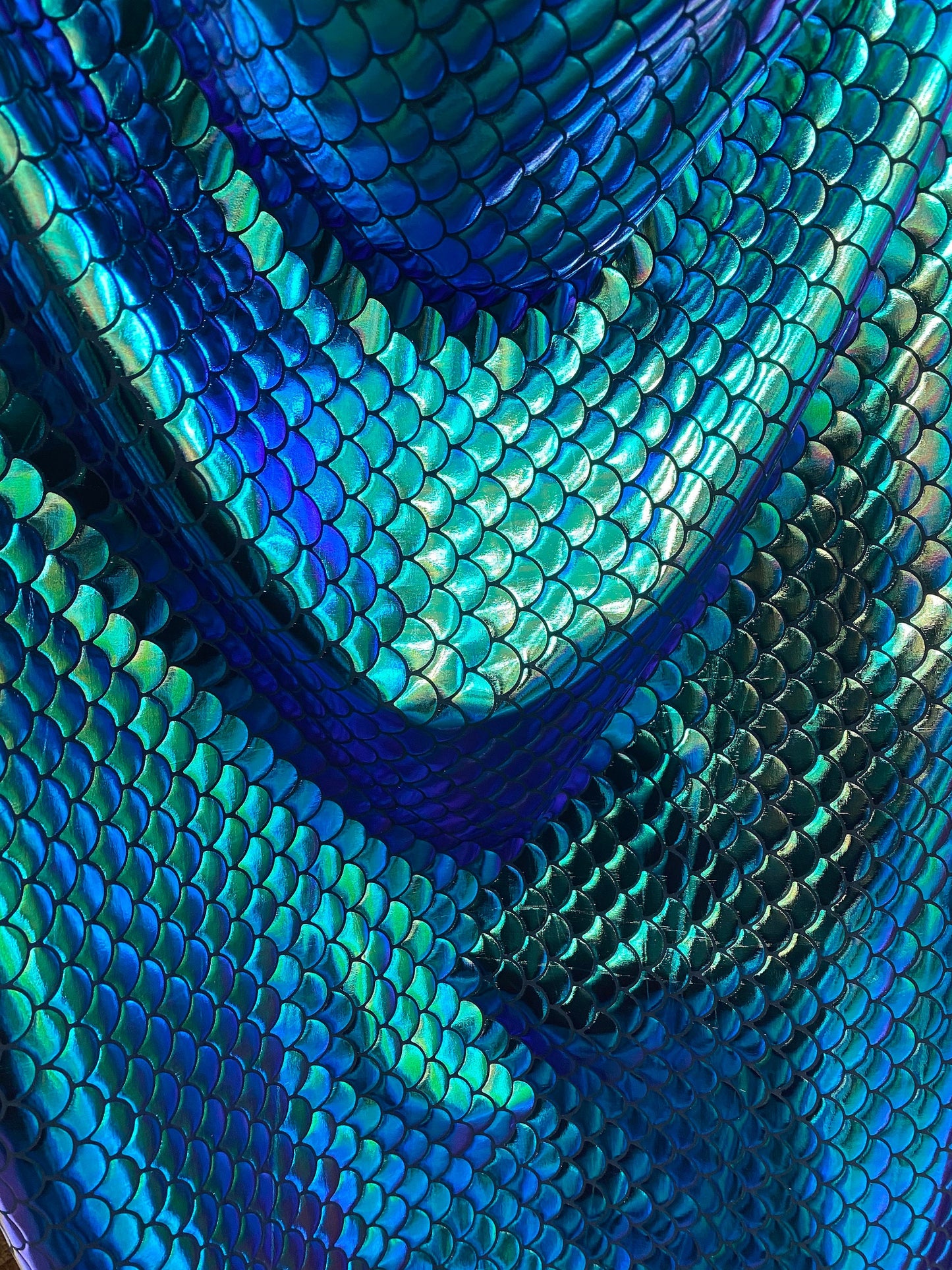 New mermaid design iridescent green metallic nylon spandex 4-way 58/60” Sold by the YD. Ships worldwide from Los Angeles California USA.