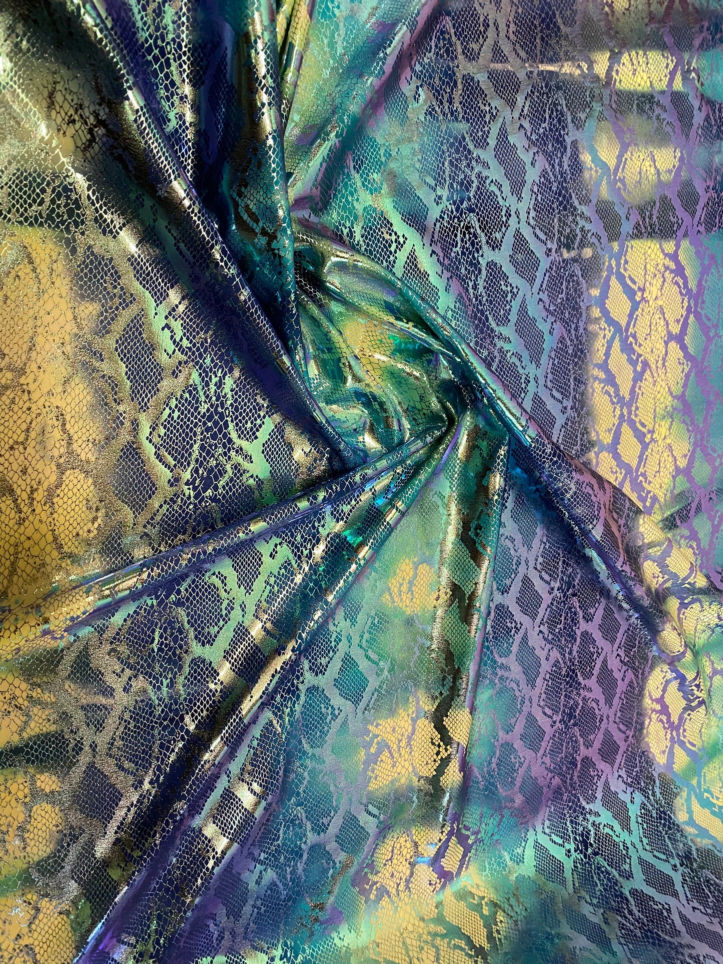 New tie dye exotic snake design metallic hologram nylon spandex with foil 4-way 58/60” Sold by the YD. Ships worldwide from Los Angeles CA.