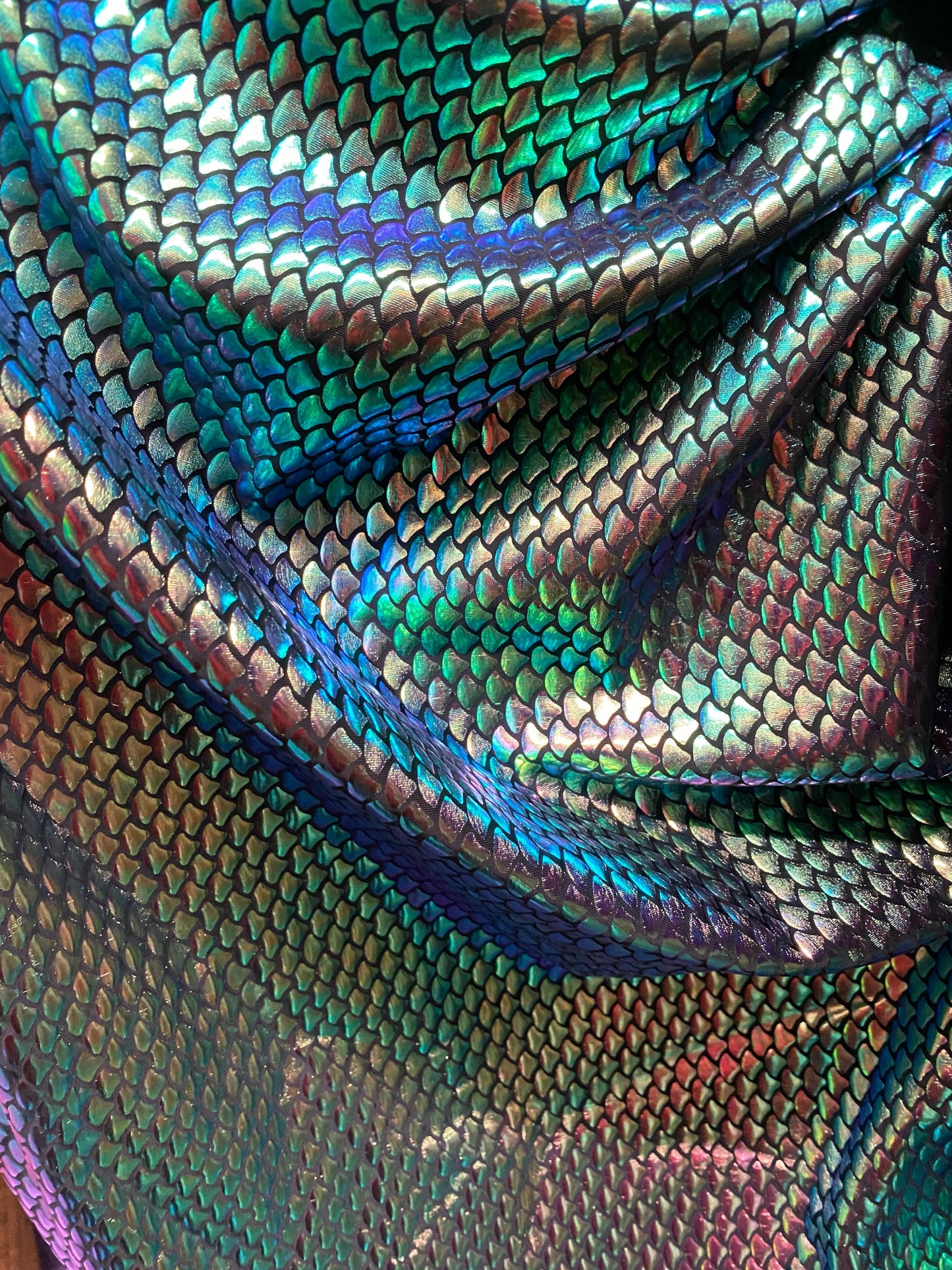 New iridescent green small mermaid design metallic hologram spandex 4-way stretch 58/60” Sold by the YD. Ships worldwide from Los Angeles CA