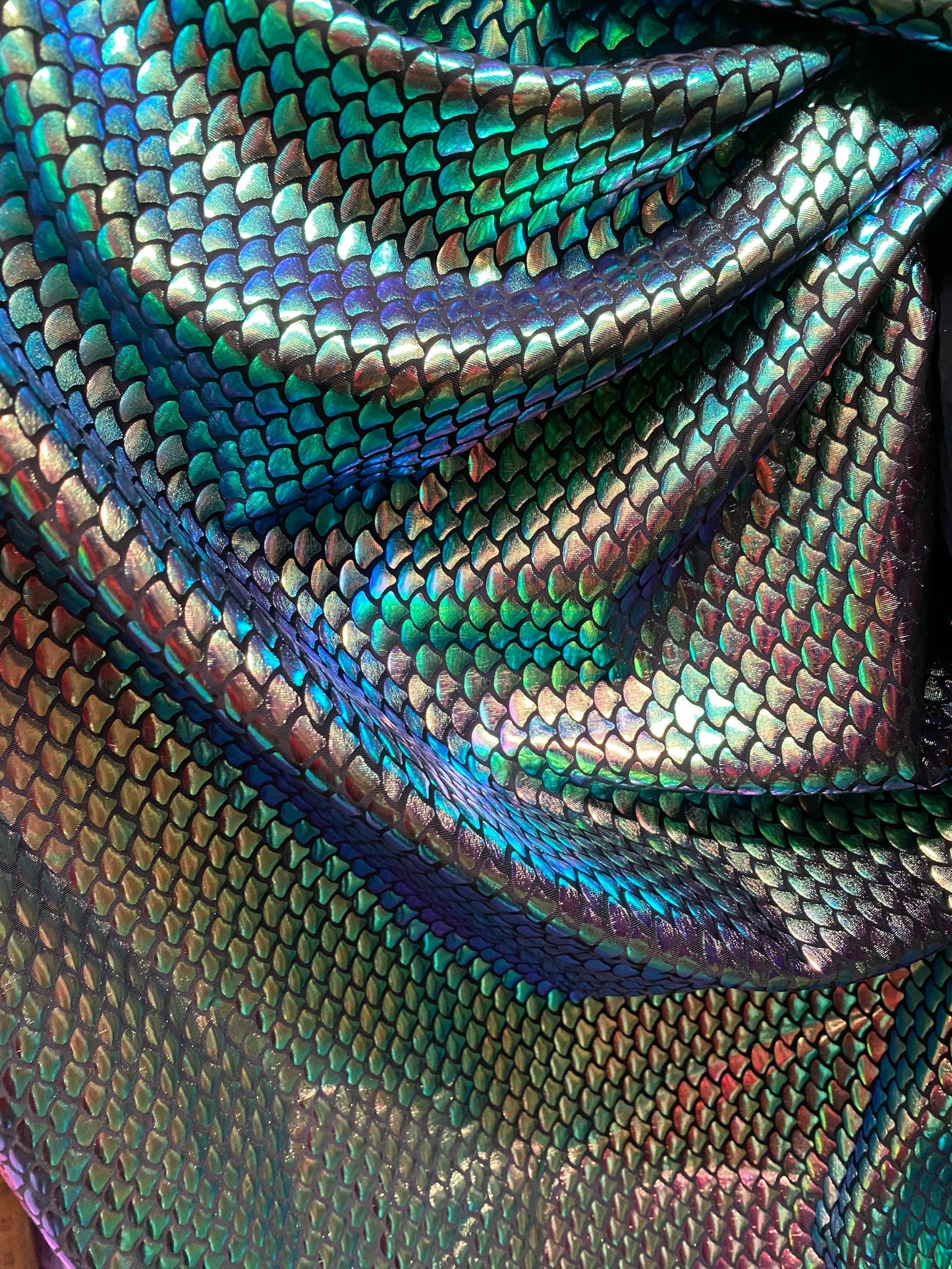 New iridescent green small mermaid design metallic hologram spandex 4-way stretch 58/60” Sold by the YD. Ships worldwide from Los Angeles CA