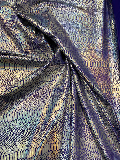 New Iridescent snake design purple/silver metallic hologram nylon spandex 4-way stretch 58/60” Sold by the YD. Ships worldwide from L.A CA.