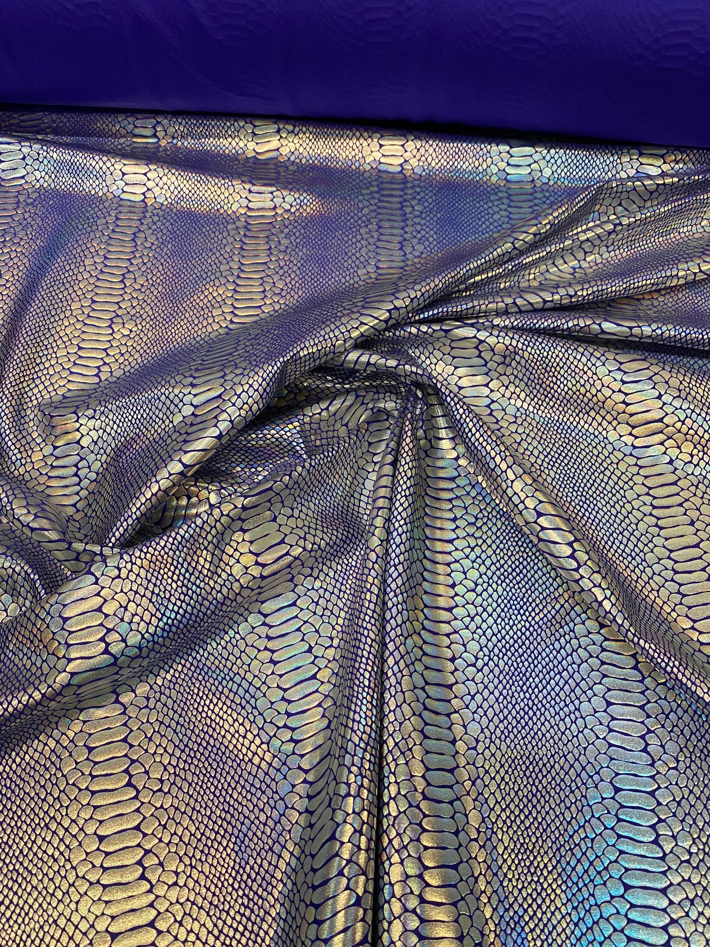 New Iridescent snake design purple/silver metallic hologram nylon spandex 4-way stretch 58/60” Sold by the YD. Ships worldwide from L.A CA.