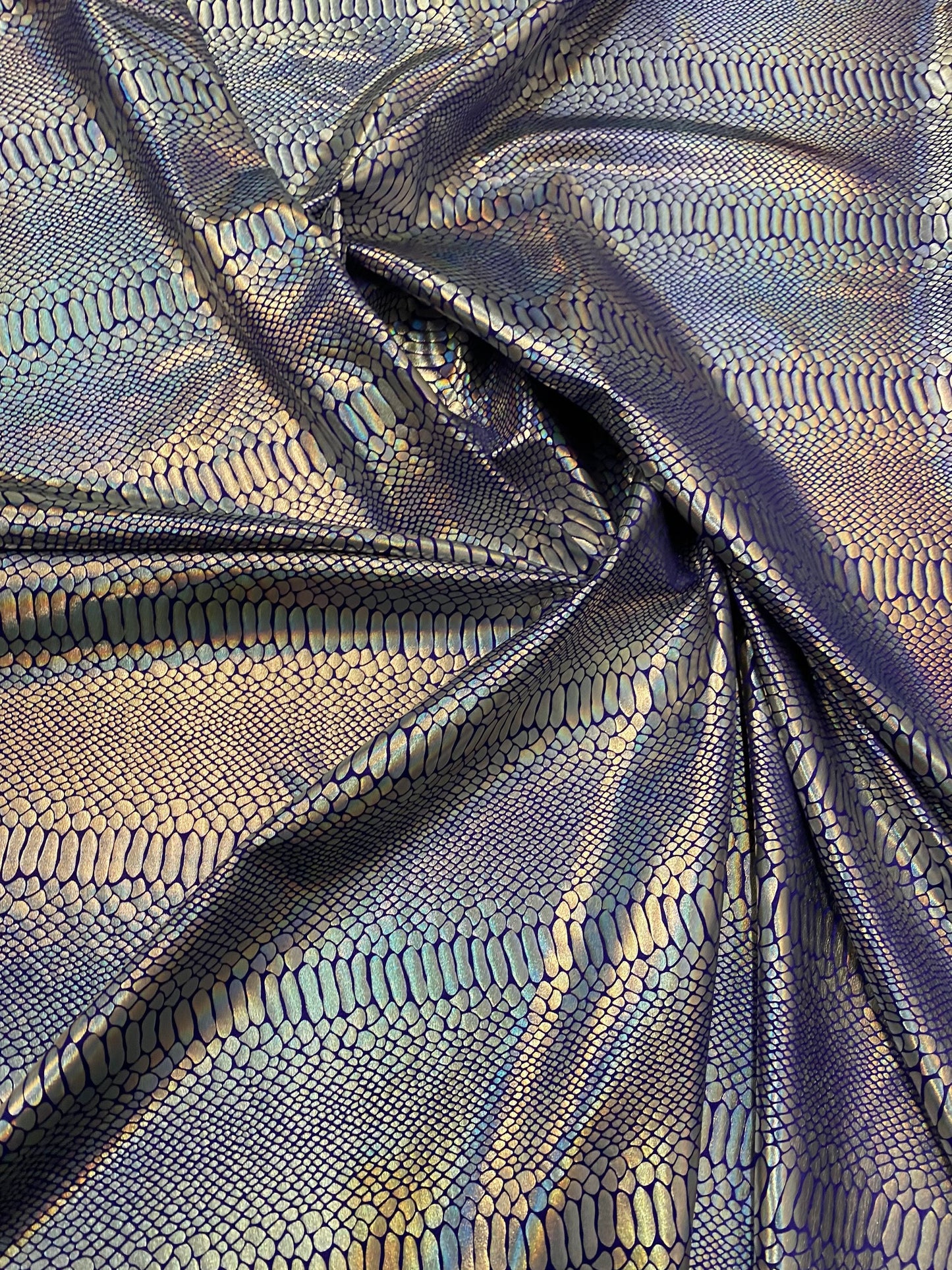 New Iridescent snake design purple/silver metallic hologram nylon spandex 4-way stretch 58/60” Sold by the YD. Ships worldwide from L.A CA.