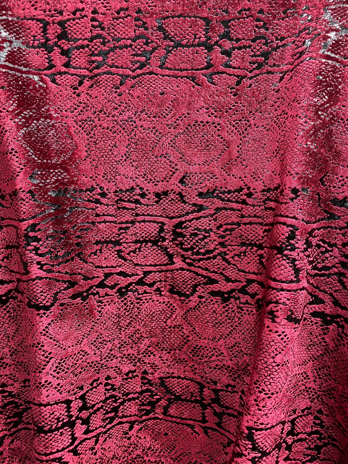 Metallic Stretch velvet snake design burgundy/black 2-way stretch 58/60” Sold by the YD. Ships worldwide from Los Angeles California USA.