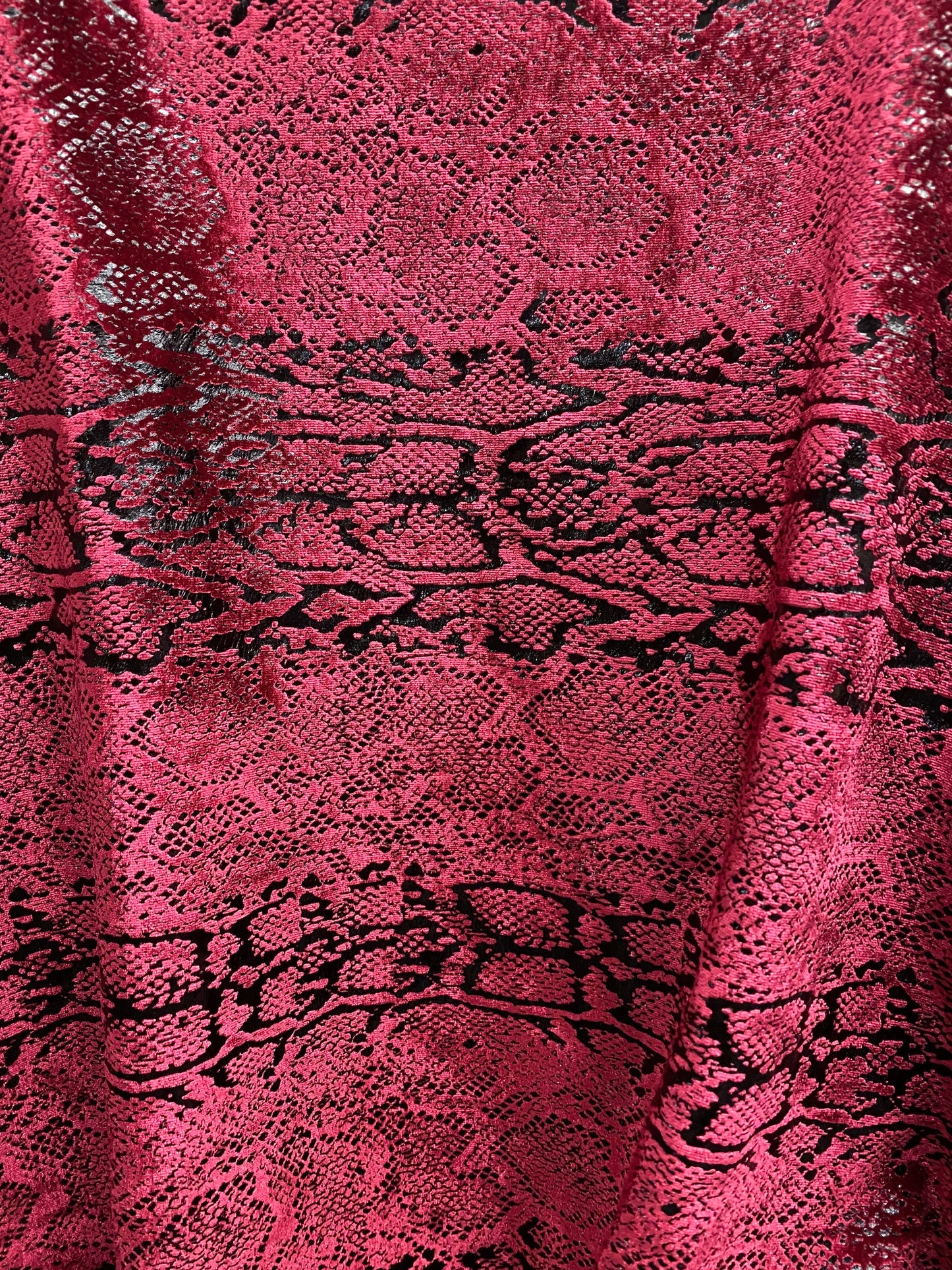 Metallic Stretch velvet snake design burgundy/black 2-way stretch 58/60” Sold by the YD. Ships worldwide from Los Angeles California USA.