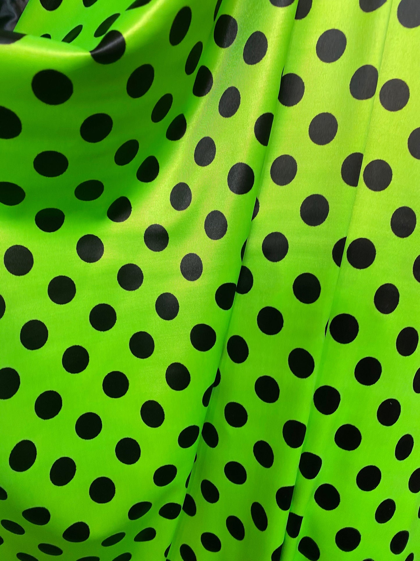 New polka dots design neon lime green with black dots nylon spandex 4-way stretch 58/60” Sold by the YD. Ships worldwide from Los Angeles CA