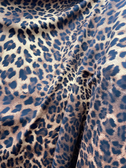 New print nylon spandex leopard design brown/taupe 4-way stretch 58/60” Sold by the YD. Ships worldwide from Los Angeles California USA.