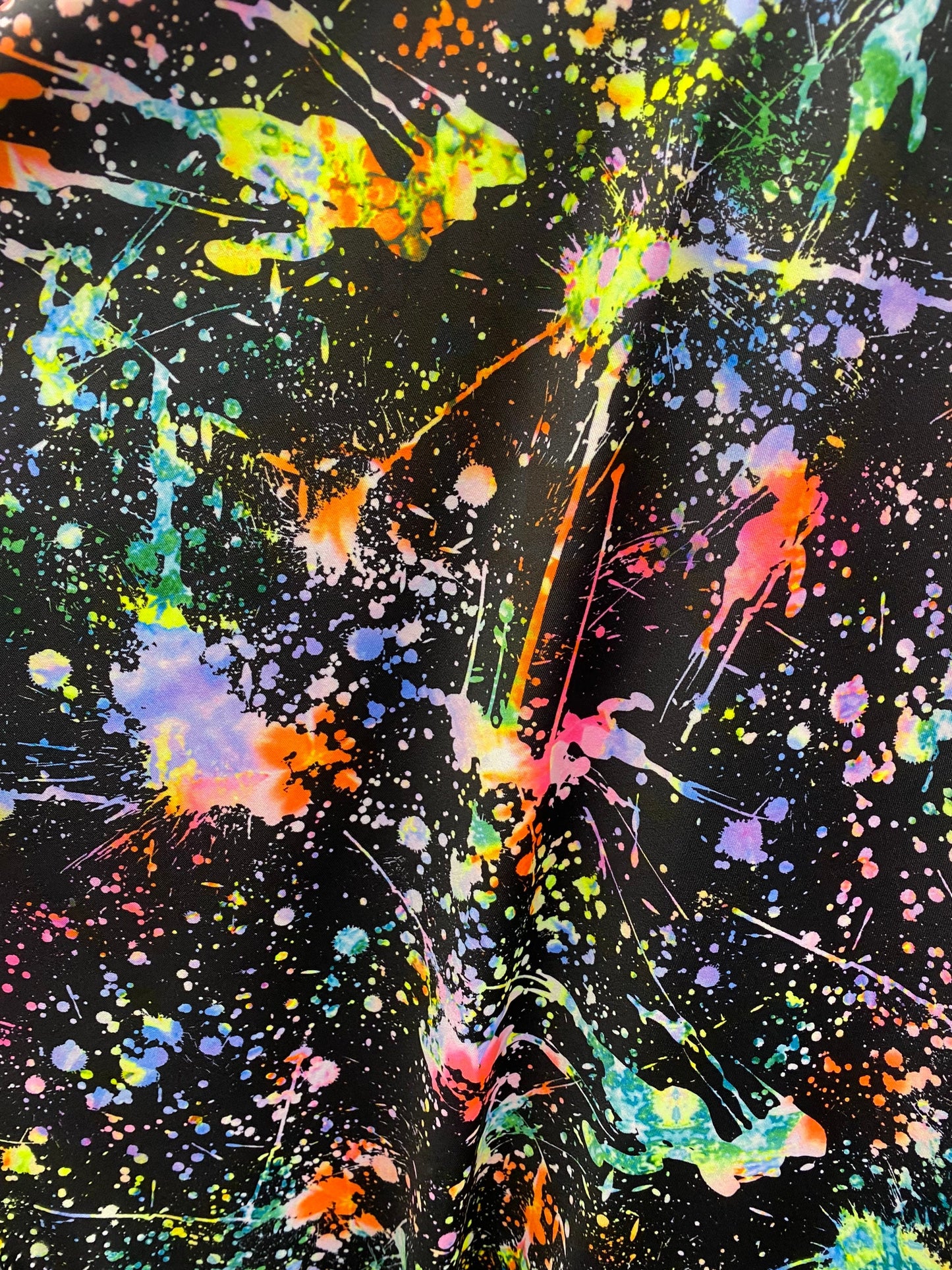 New splatter paint design print on nylon spandex 4-way stretch 58/60” Sold by the YD. Ships worldwide from Los Angeles California USA.