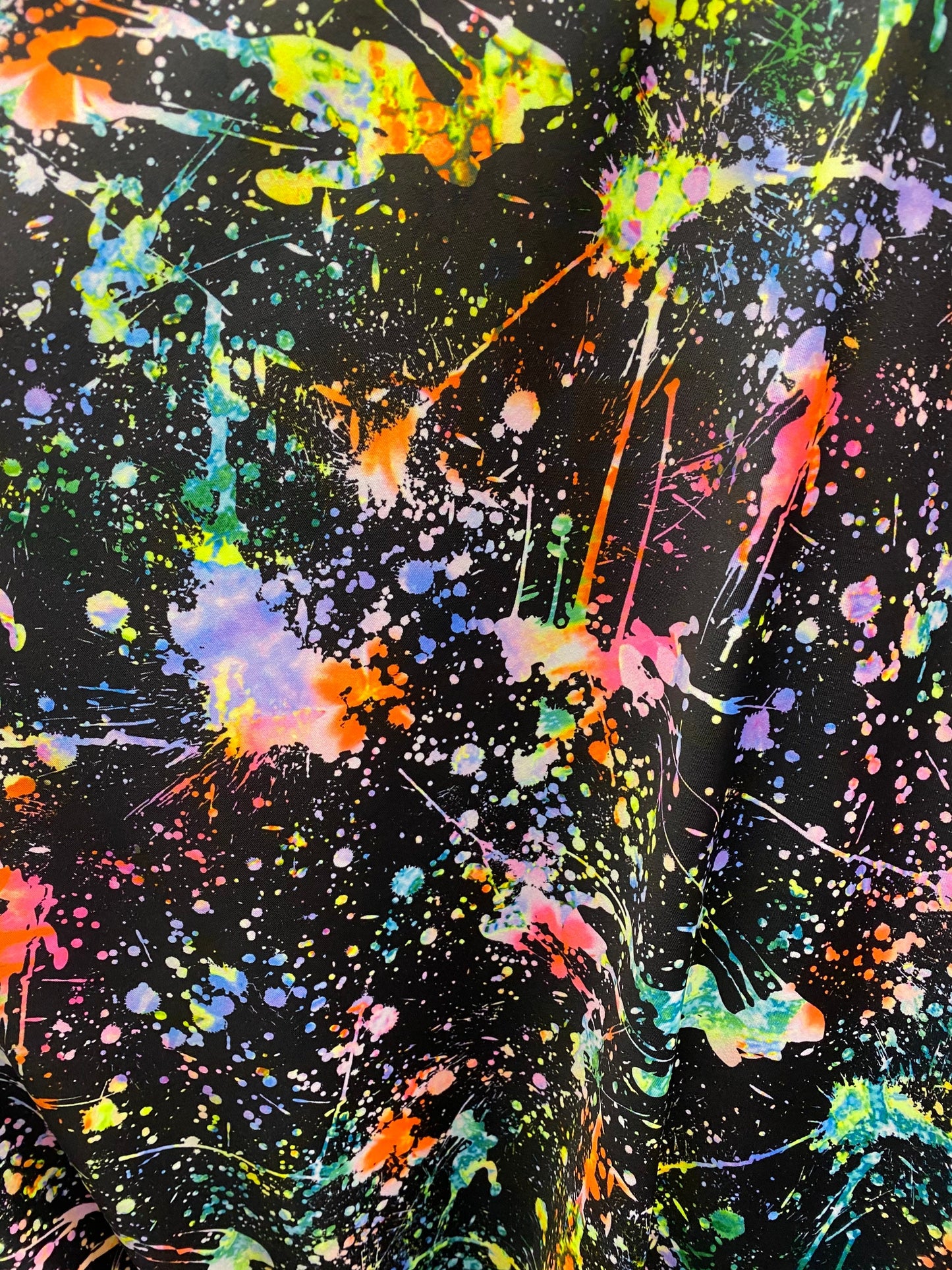 New splatter paint design print on nylon spandex 4-way stretch 58/60” Sold by the YD. Ships worldwide from Los Angeles California USA.