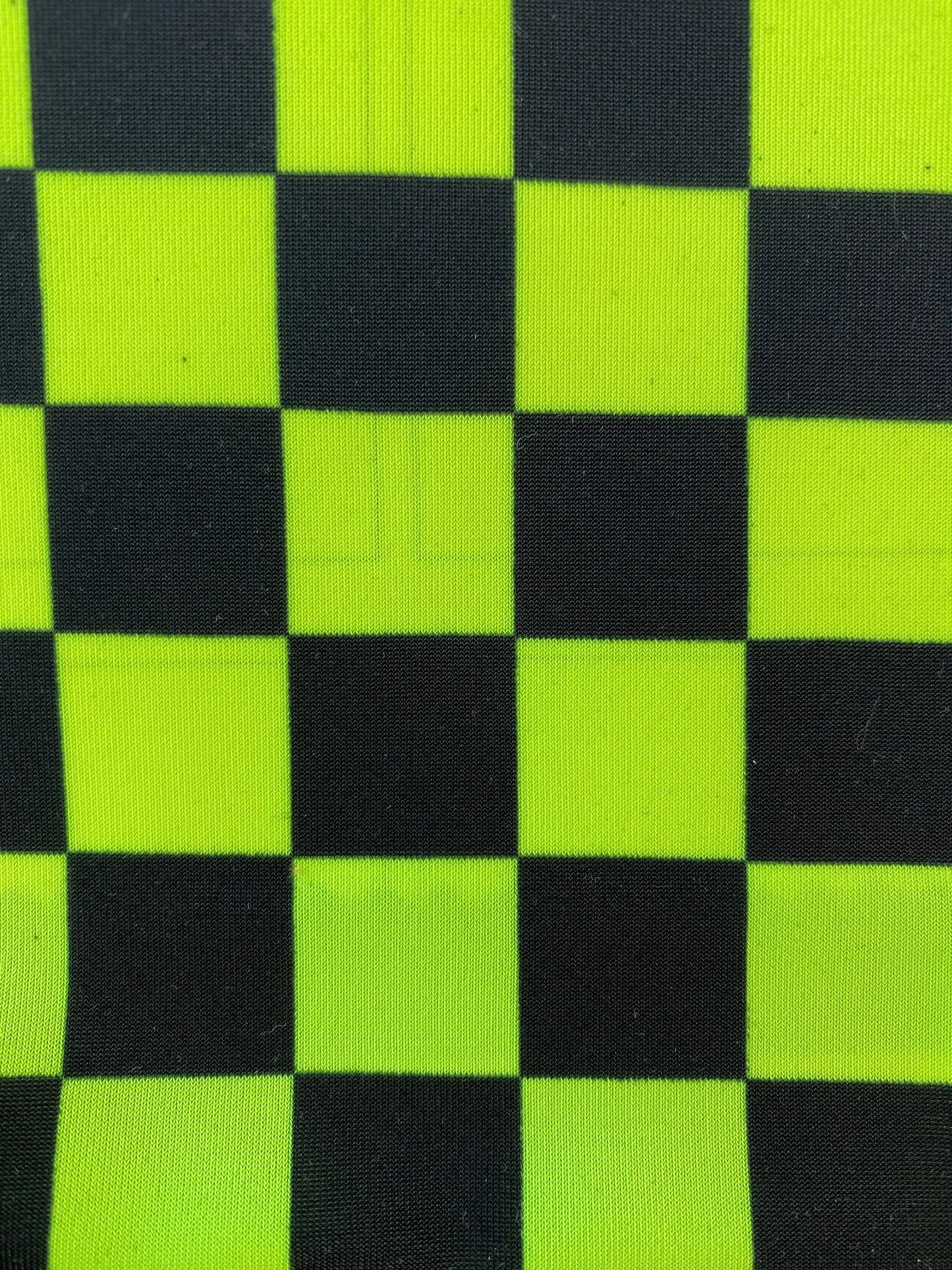 New poly spandex checkers design 4-way stretch 58/60” Sold by the YD. Ships worldwide from Los Angeles California USA.