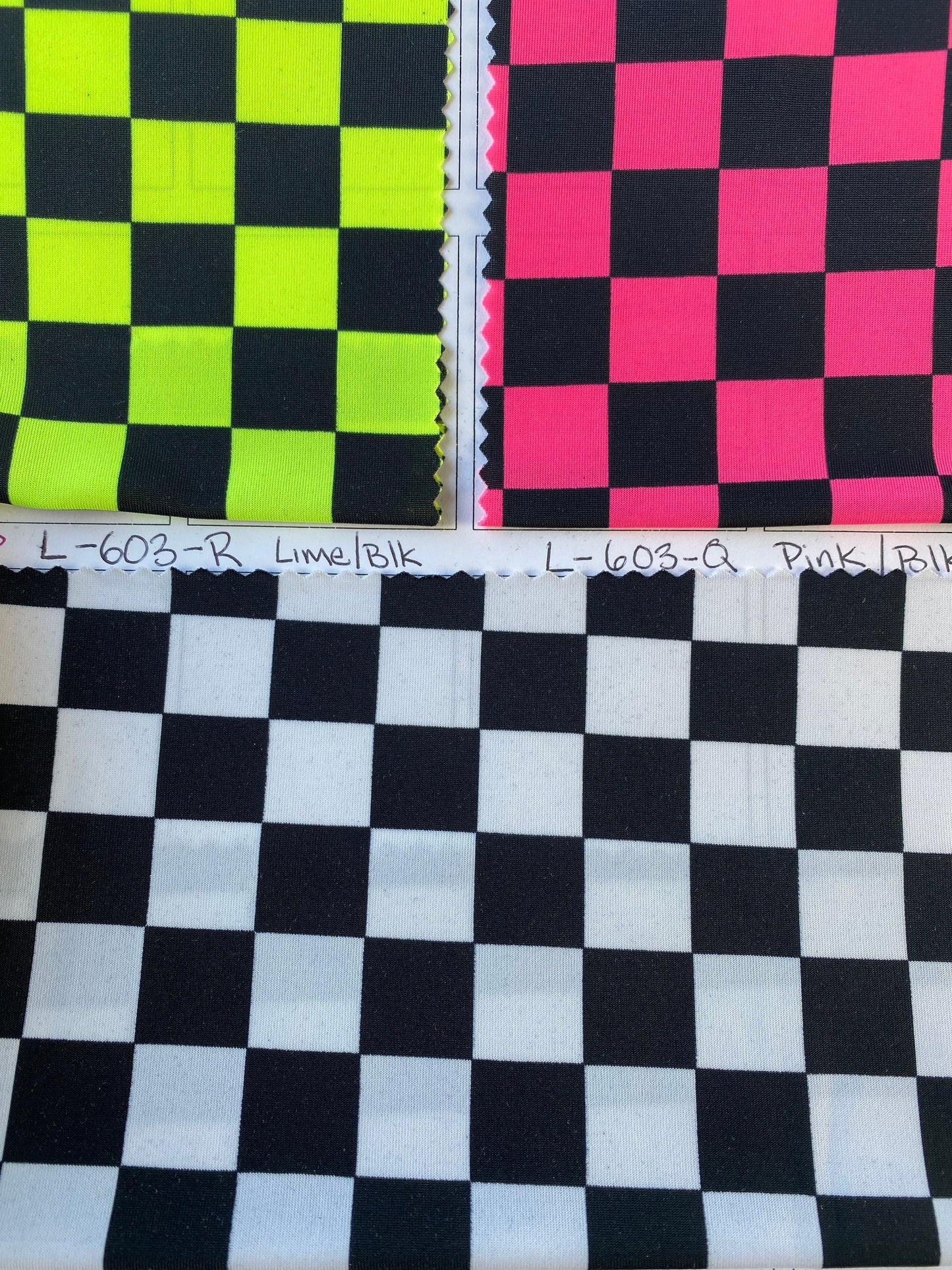 New poly spandex checkers design 4-way stretch 58/60” Sold by the YD. Ships worldwide from Los Angeles California USA.