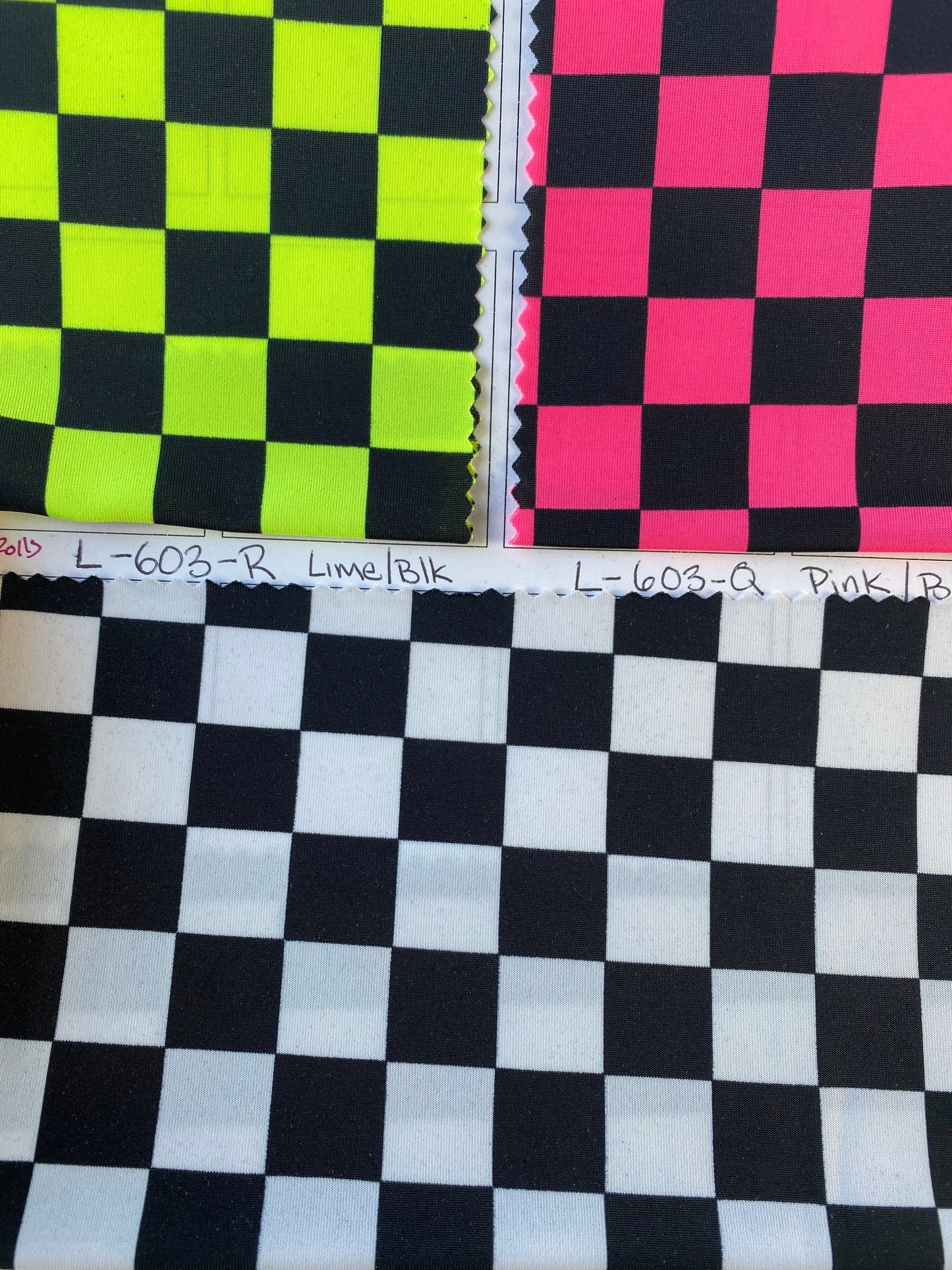 New poly spandex checkers design 4-way stretch 58/60” Sold by the YD. Ships worldwide from Los Angeles California USA.