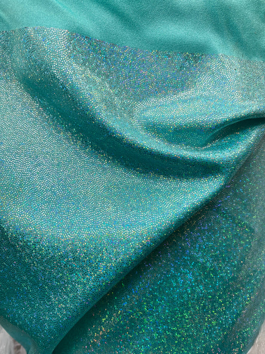 Sparkle hologram metallic nylon spandex 4way stretch 58/60” Sold by the YD. Ships worldwide from Los Angeles California USA.