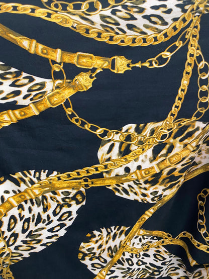 New Black and Gold print Chains all over on DTY brush 4-way stretch poly spandex fabric 58/60” Sold by the YD. Ships Los Ángeles CA.