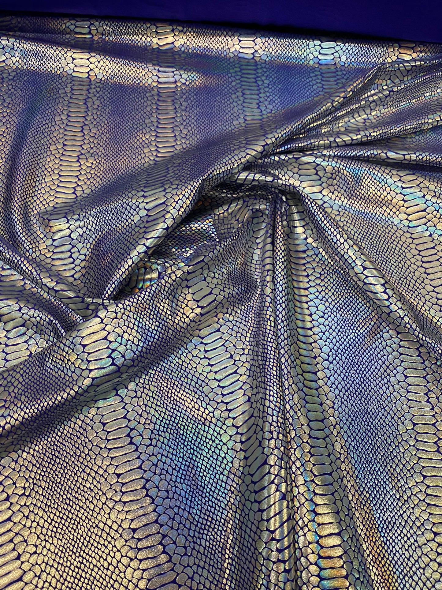 New Iridescent snake design purple/silver metallic hologram nylon spandex 4-way stretch 58/60” Sold by the YD. Ships worldwide from L.A CA.