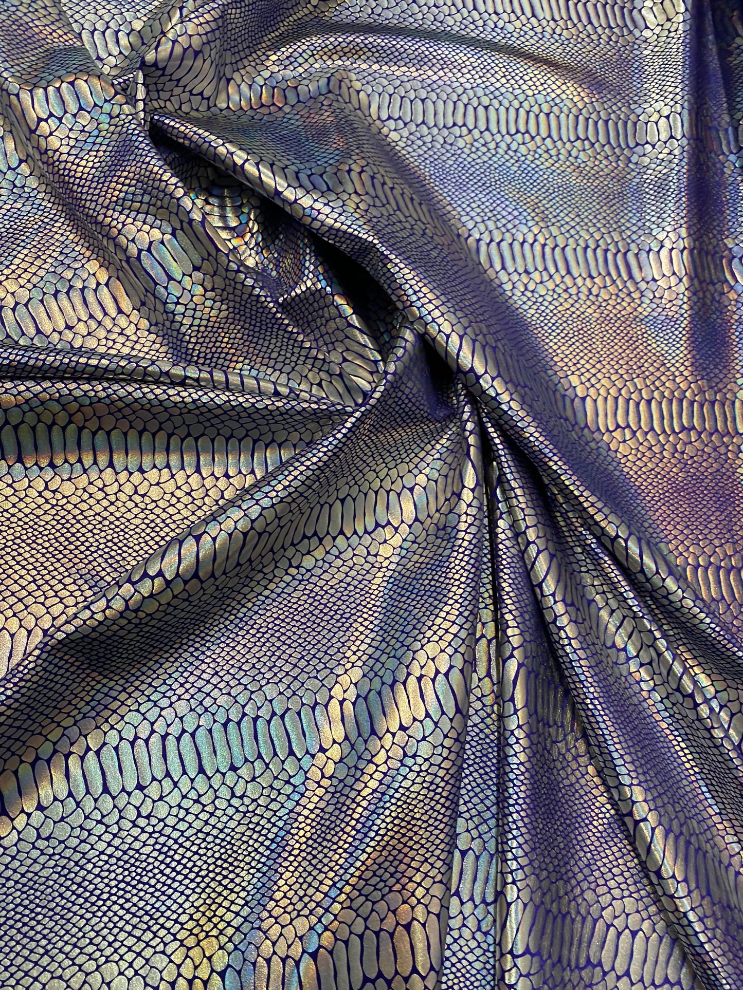 New Iridescent snake design purple/silver metallic hologram nylon spandex 4-way stretch 58/60” Sold by the YD. Ships worldwide from L.A CA.